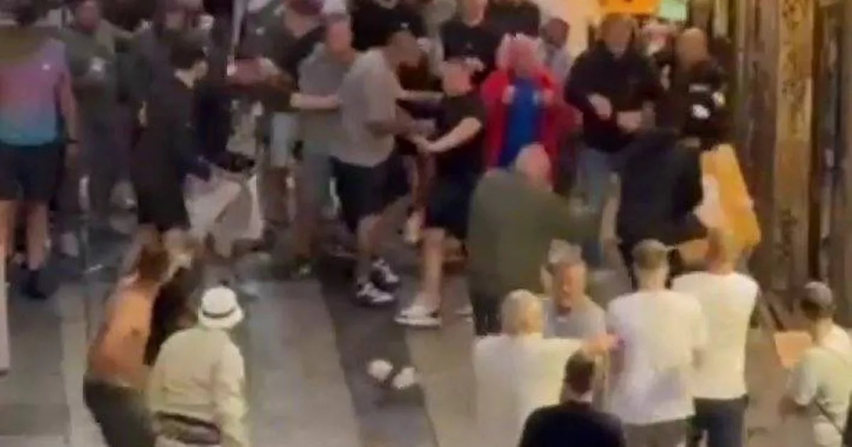 Man Utd and Tottenham fans brawl in streets of Spain with punches and objects thrown