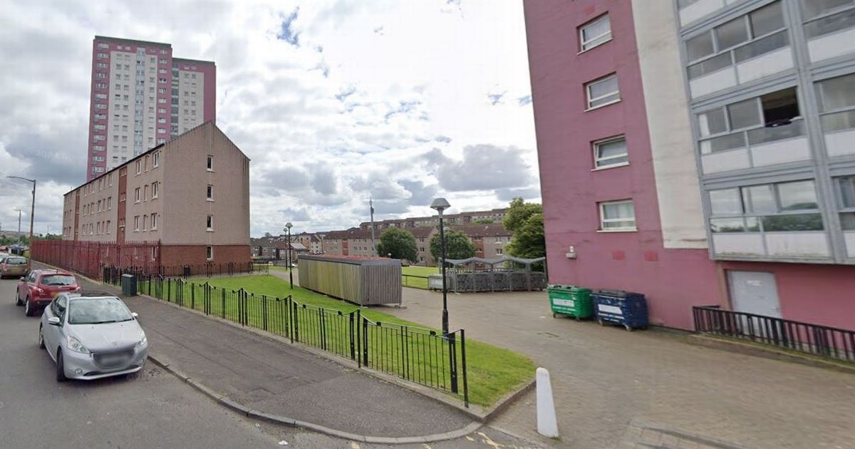 Woman arrested after man's body found at Glasgow flats