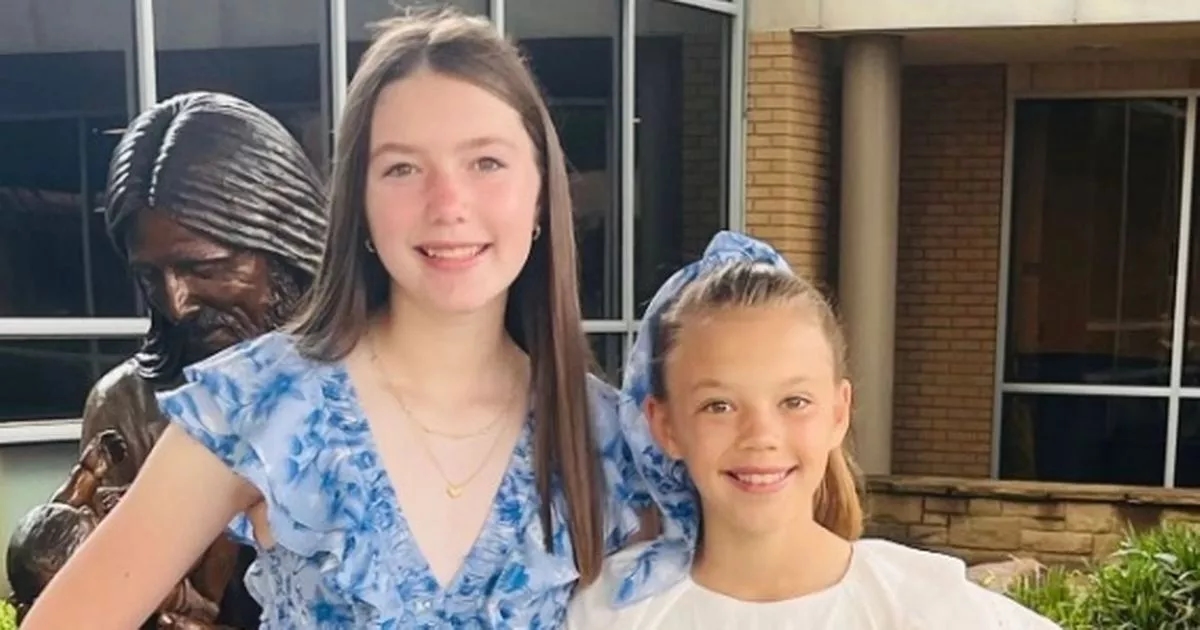Sisters, 11 and 13, found dead as hunt continues for 27 missing in horror floods
