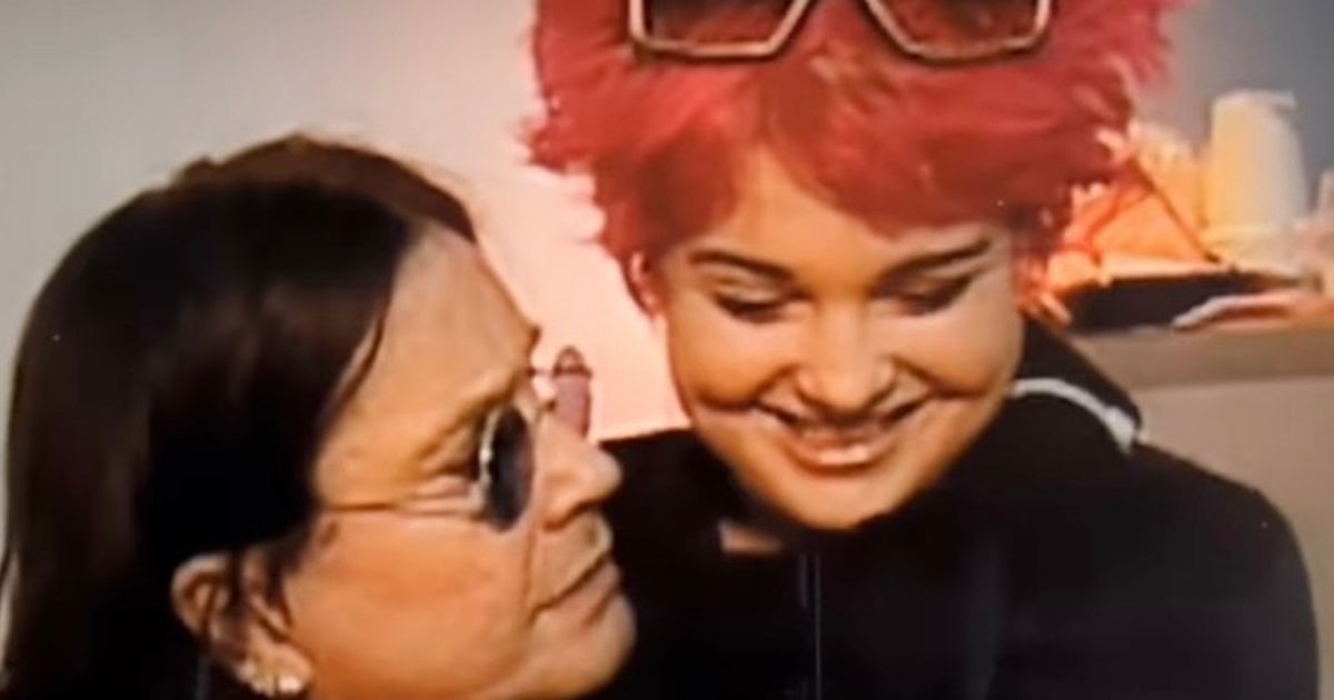 Kelly Osbourne shares heartbreaking video sat in arms of dad Ozzy