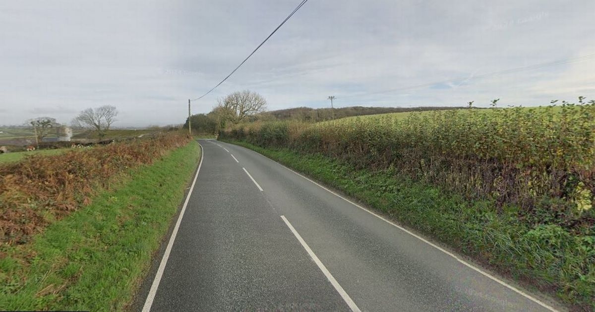 Road closed for hours after crash between car and tractor