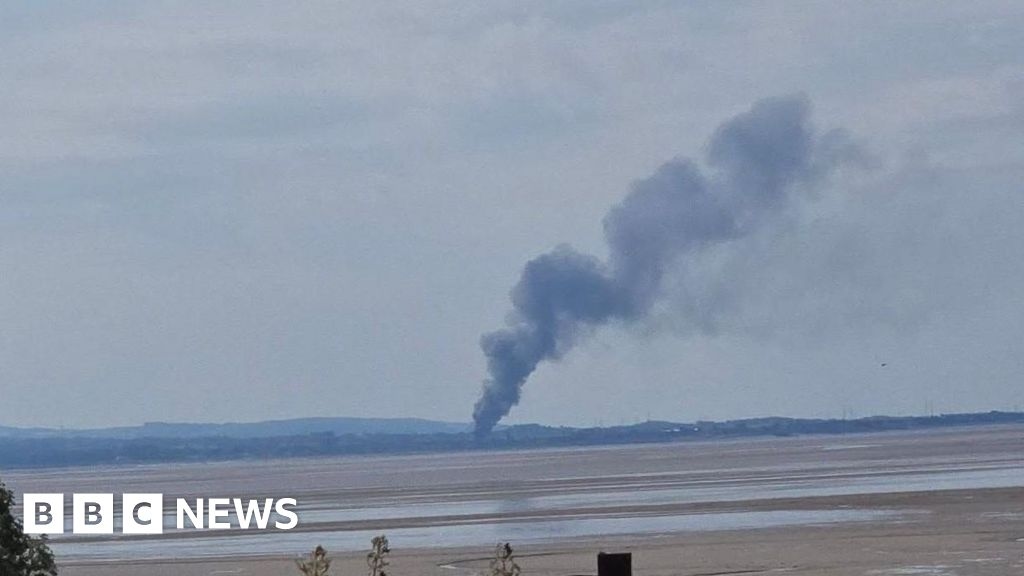 Crews tackle fire at industrial site as smoke seen miles away