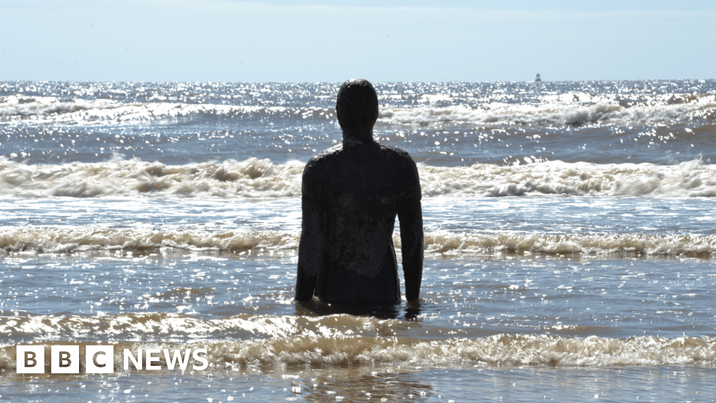 In pictures: Antony Gormley's Crosby iron men over the years