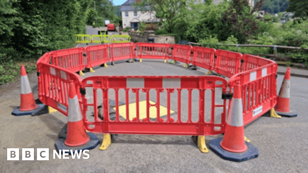 Sinkhole closes down road through Gloucestershire village