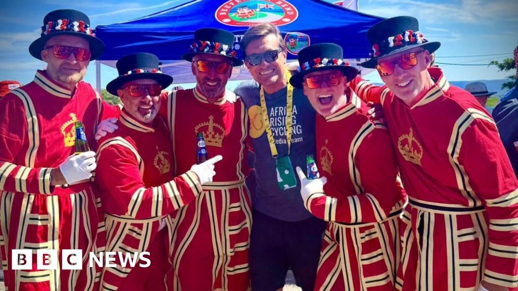 Friends dress as Beefeaters to cheer on cyclists
