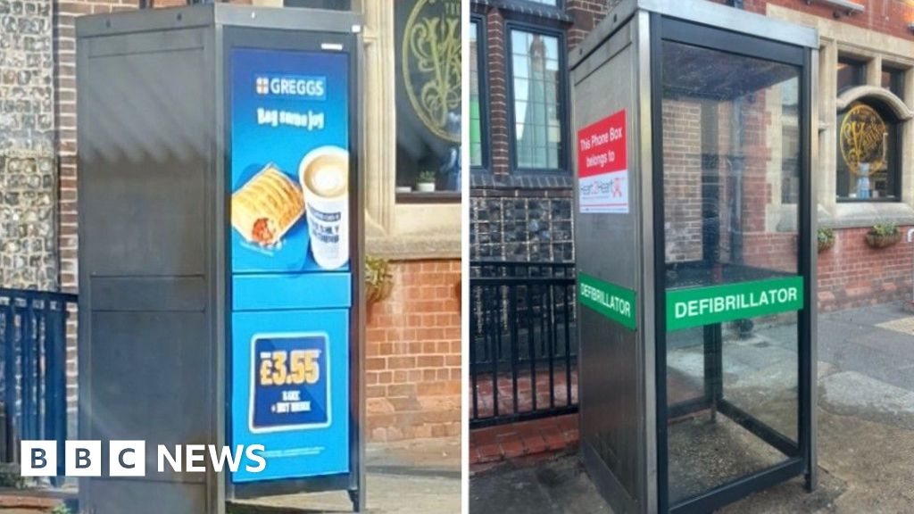 Defibrillator phone box in Gorleston covered by advertising
