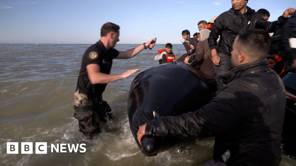 French police slash inflatable migrant boat heading to UK