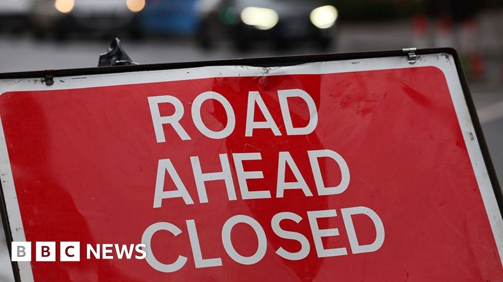 Bacup road closed after bus crashes into cars and telegraph pole