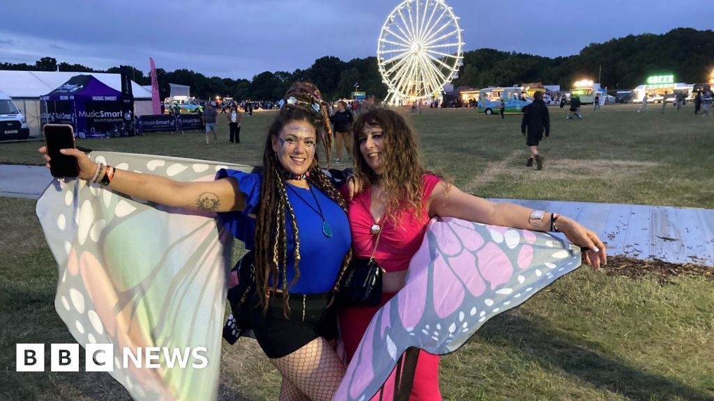 Godiva Festival-goers in Coventry with fancy dress and flowers