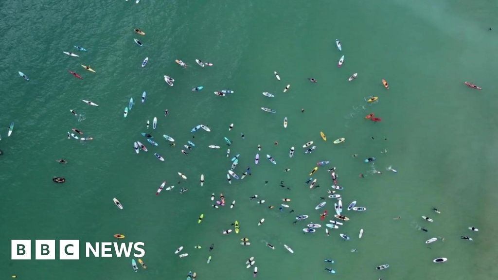 Hundreds in Devon and Cornwall join paddle out sewage protests