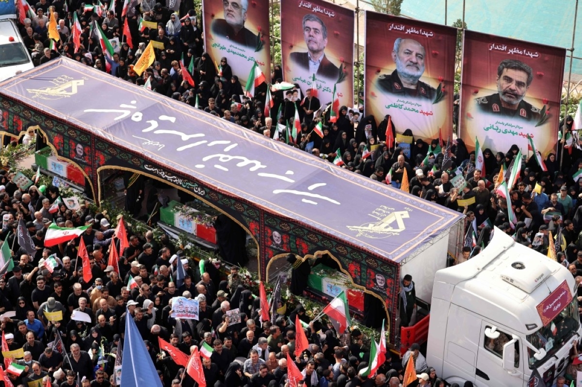 Iran holds funeral for slain scientists and commanders