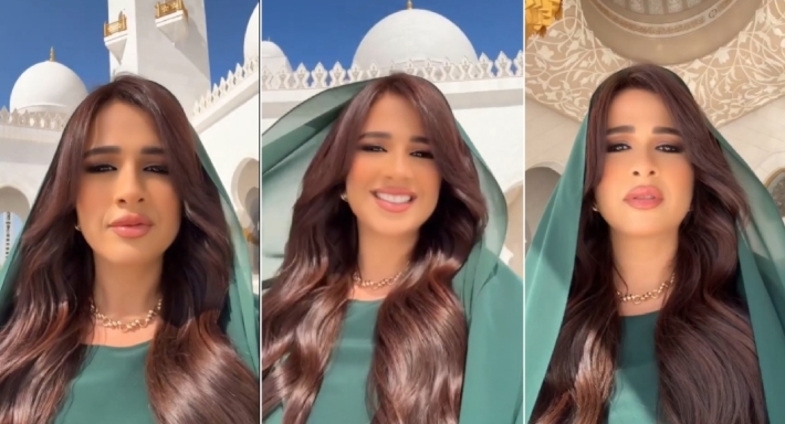 ياسمين عبد العزيز بعباءة خضراء وغطاء الرأس في جامع الشيخ زايد الكبير بأبوظبي