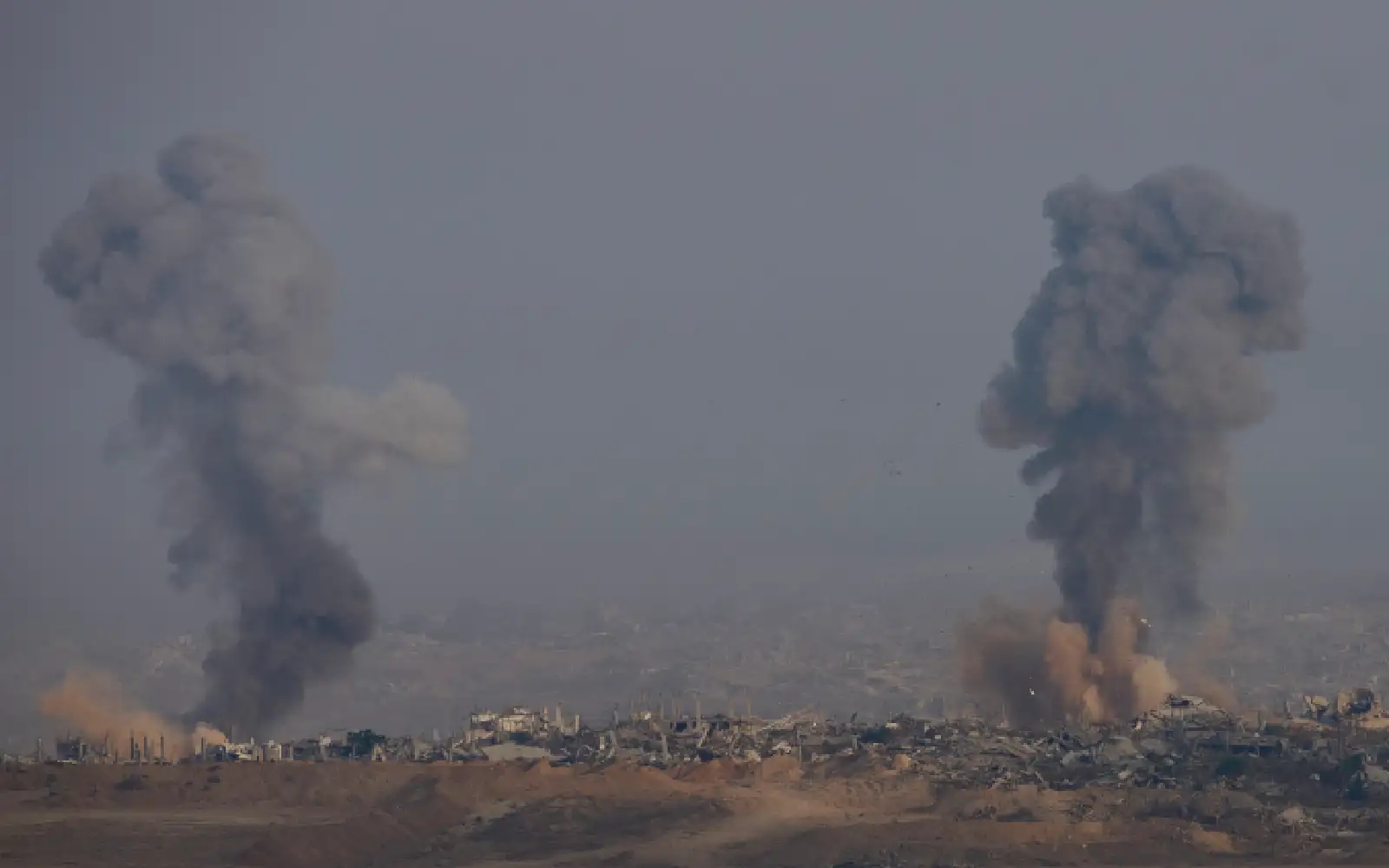 Israeli strikes in north and south Gaza leave 14 dead