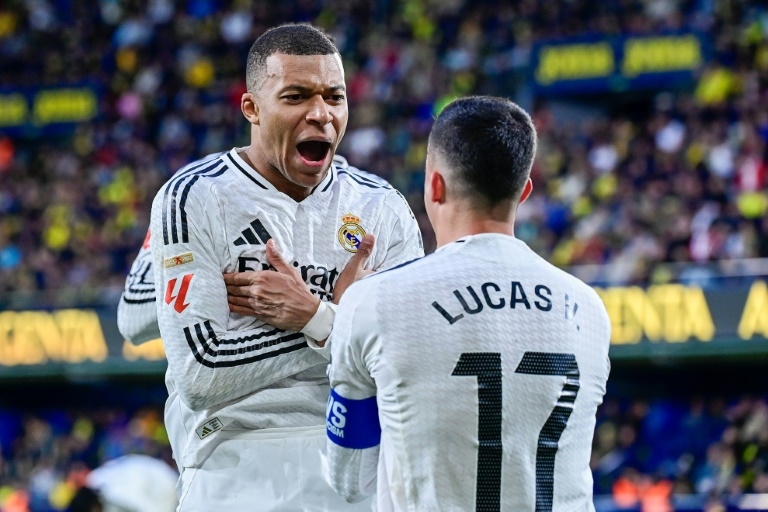 Mbappe double at Villarreal takes Real Madrid top
