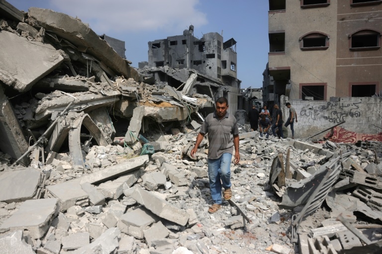 Gaza rescuers say Israeli forces kill over 50 as ceasefire calls mount