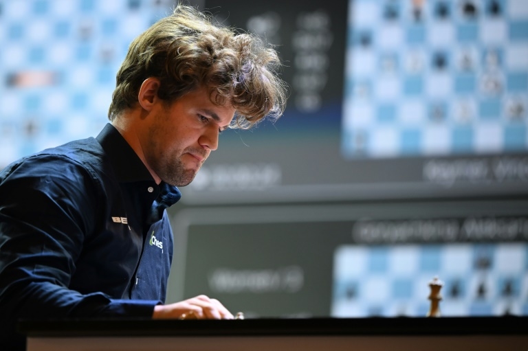 Chess great Carlsen held to draw by 143,000 players