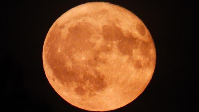 Rare Strawberry Moon captured over region