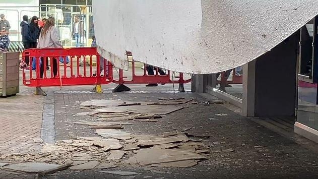Plasterboard collapses on to shops in town centre