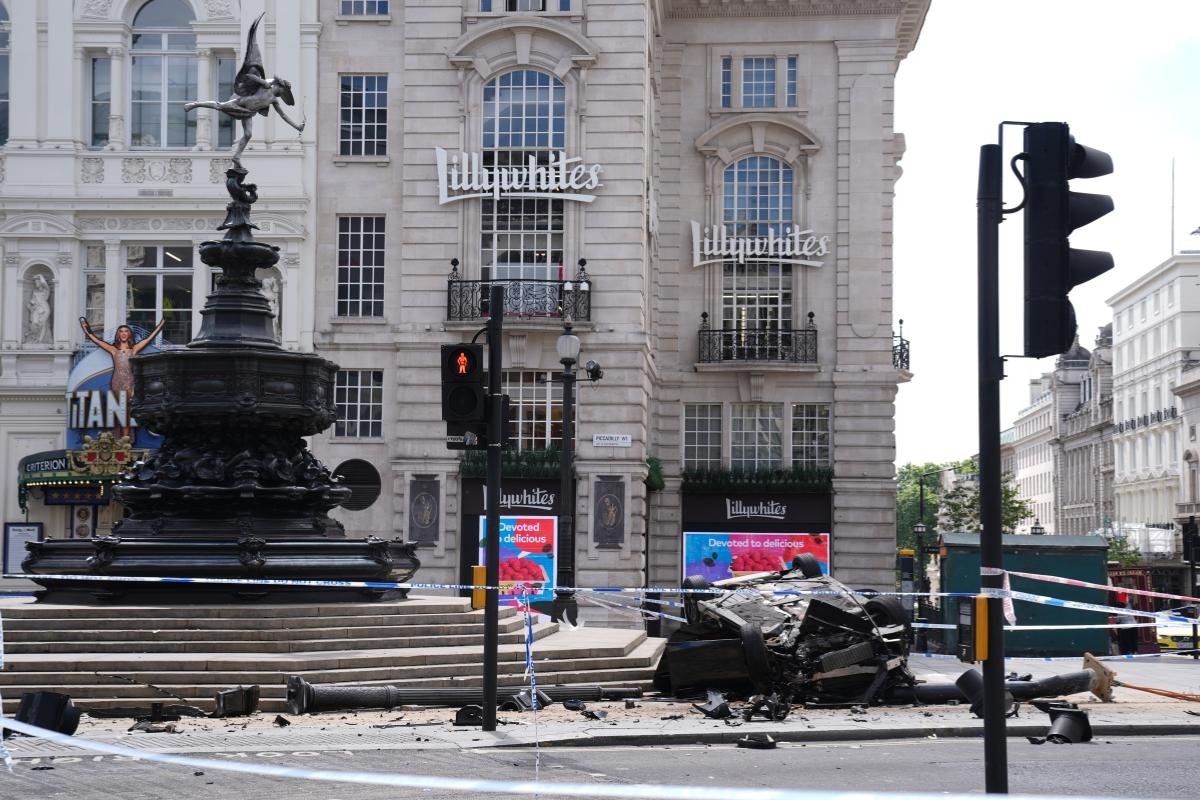 Man, 22, fighting for life after BMW crashes into Piccadilly Circus fountain