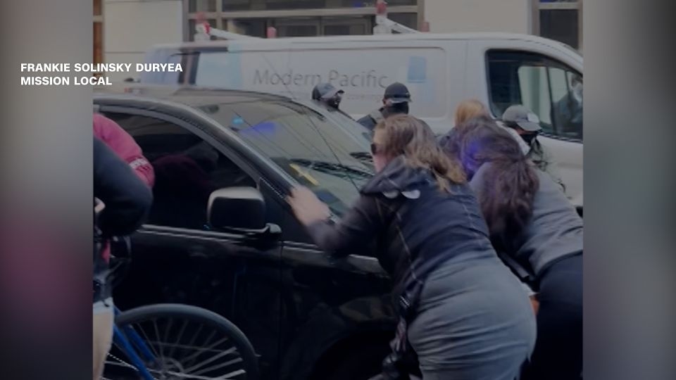 ICE vehicle runs through a group of protesters