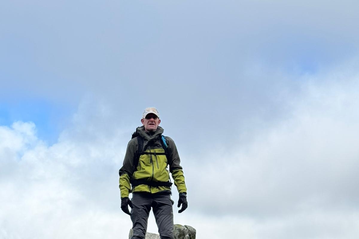 Support for man cycling length of country and hiking up three mountains