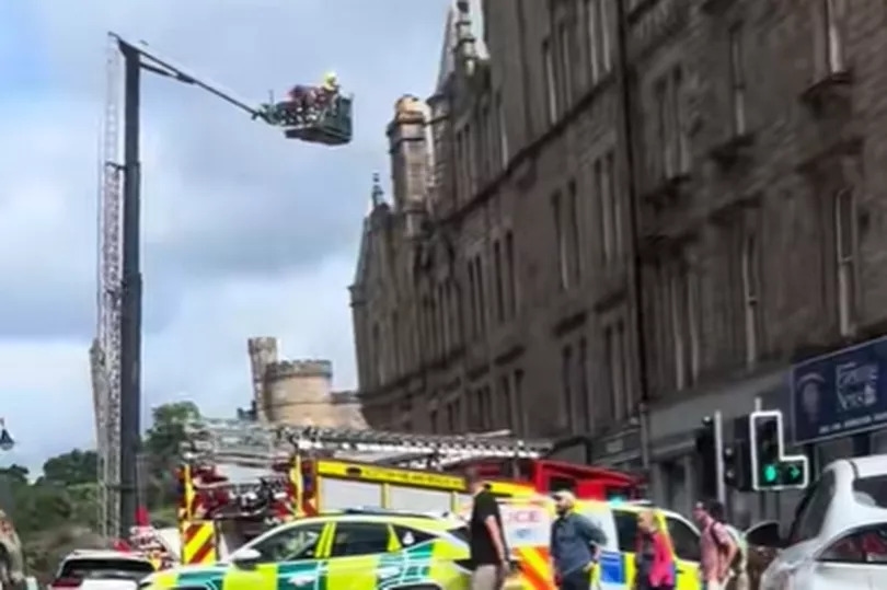 Moment Edinburgh blaze rips through city centre building as fire crews swarm street