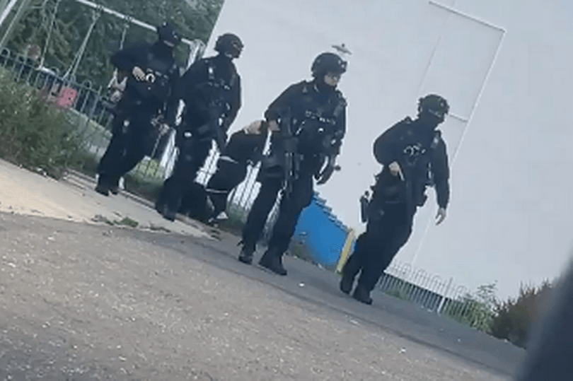 Armed police swarm Edinburgh housing scheme amid ongoing incident