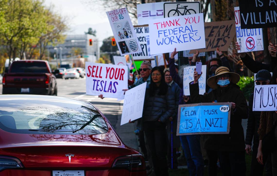 Anti-Elon Musk protester charged, accused of hitting pro-Musk counterprotester with car