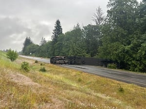 Semi carrying whiskey tips over on I-90