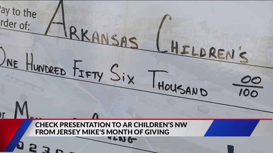 Check presentation: Fundraiser for Arkansas Children's exceeds goal