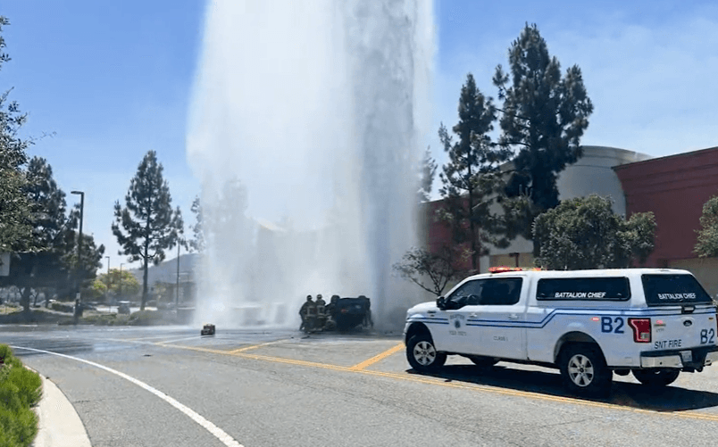 Car flips in Santee, striking fire hydrant and causing 50-foot geyser