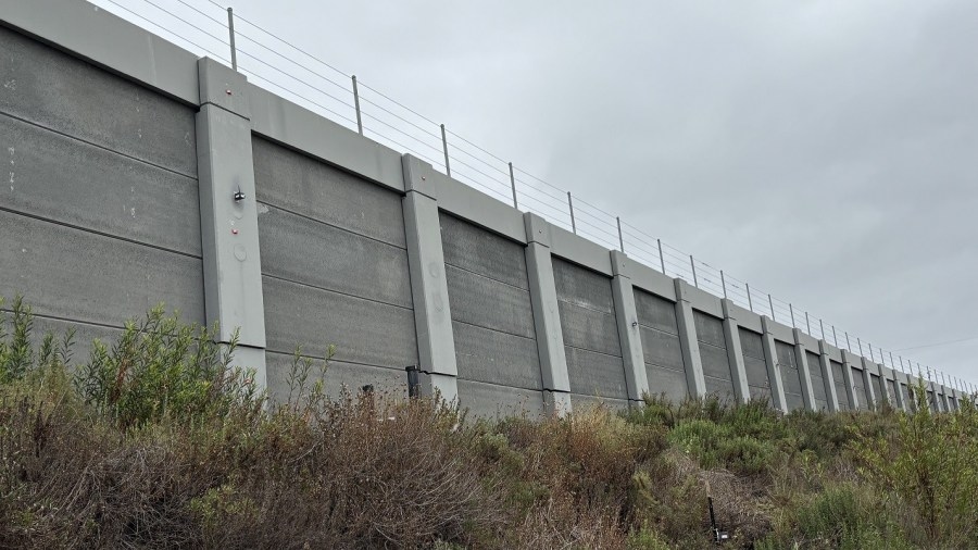 Emergency stabilization work underway on retaining wall along train tracks in Bay Ho