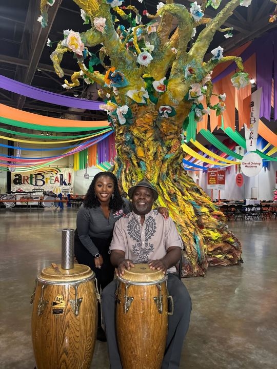 Making music using a Güiro at ArtBreak 2025