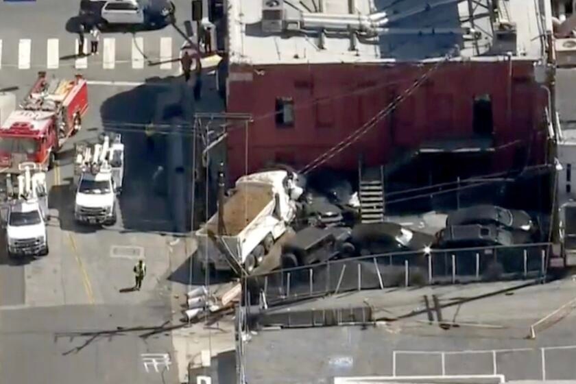 Dump truck crashes into Whisky a Go Go, knocks out power, authorities say