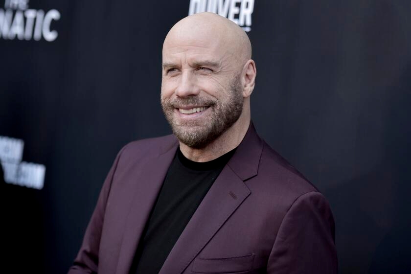 John Travolta crashes 'Grease' sing-along at Hollywood Bowl in full Danny Zuko flair