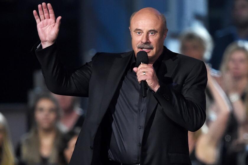 Dr. Phil's TV network files for bankruptcy and sues distribution partner