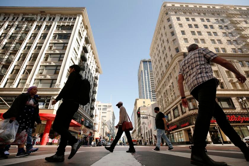A world away from the Palisades and Altadena, apartment landlords try to sell fire victims on living downtown