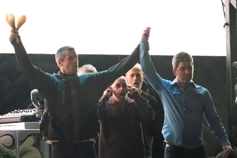 Hand in hand, the Gallagher brothers show Oasis are back