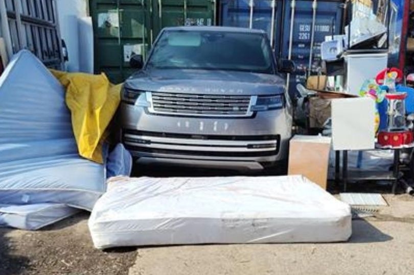 'Stolen' vehicles worth more than £250k hidden under mattresses as police storm yard in raid