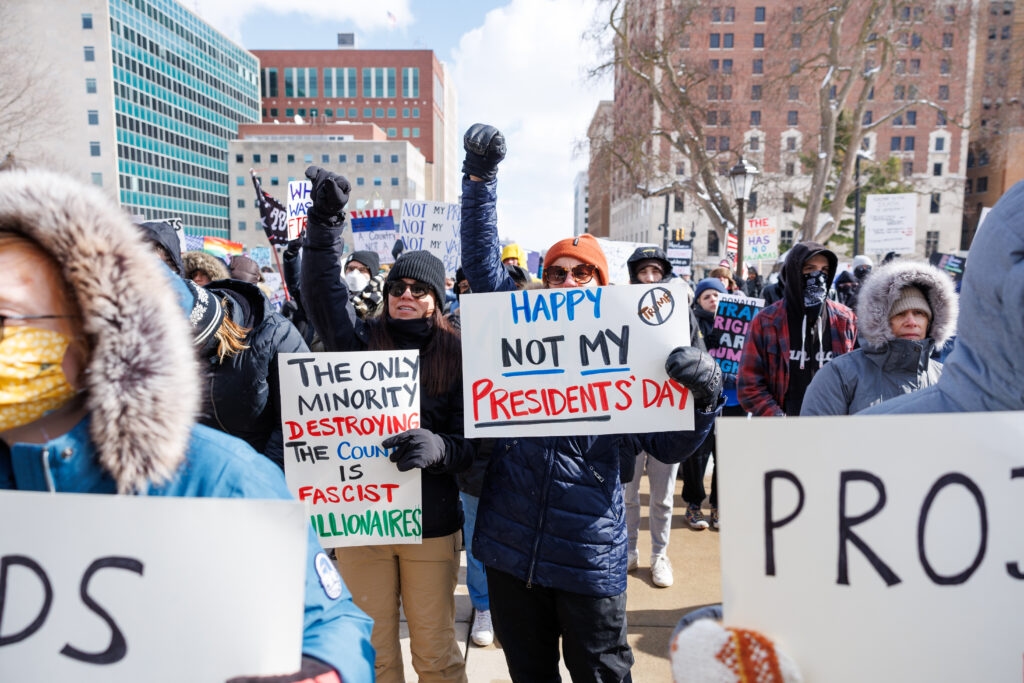 Despite below freezing temps, protestors rally against Trump, urge Democrats to take action