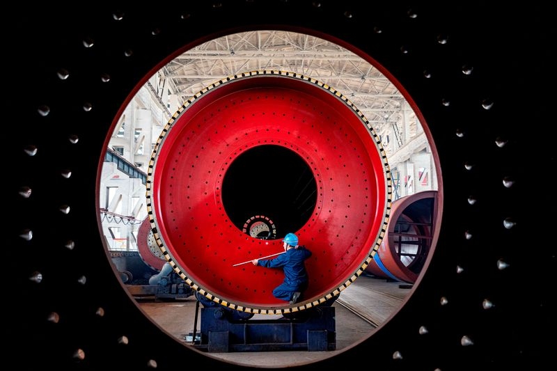 China's factory activity returns to growth in June, Caixin PMI shows