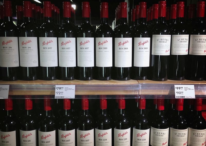 Australia's Treasury Wine drops planned sale of cheaper brands, cuts profit guidance