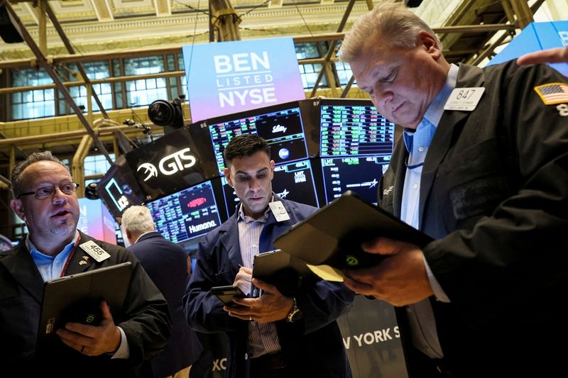 Wall St futures mixed as investors weigh Alphabet, Tesla earnings