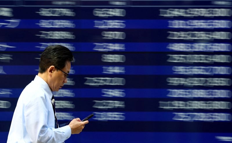Asian stocks slip from highs, dollar gains as markets brace for crucial week