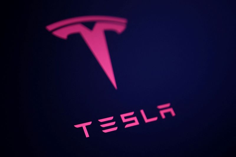 Tesla says it started building initial versions of an affordable car, posts a steep sales decline