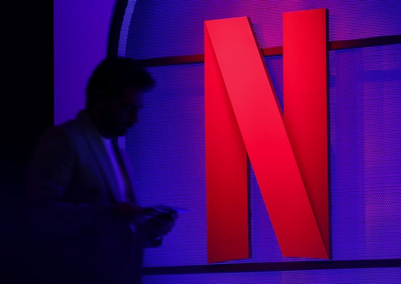 Netflix holds talks with Spotify to expand live TV content, WSJ reports