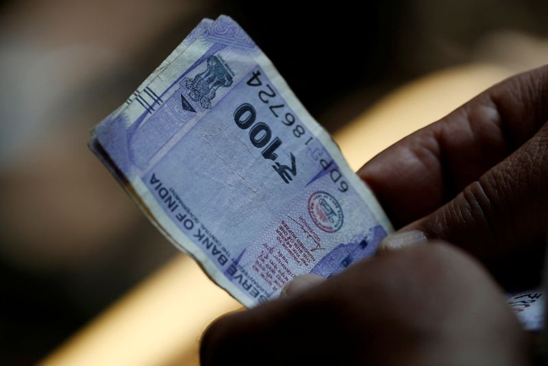 Rupee inches up tracking regional peers, spotlight stays on tariffs