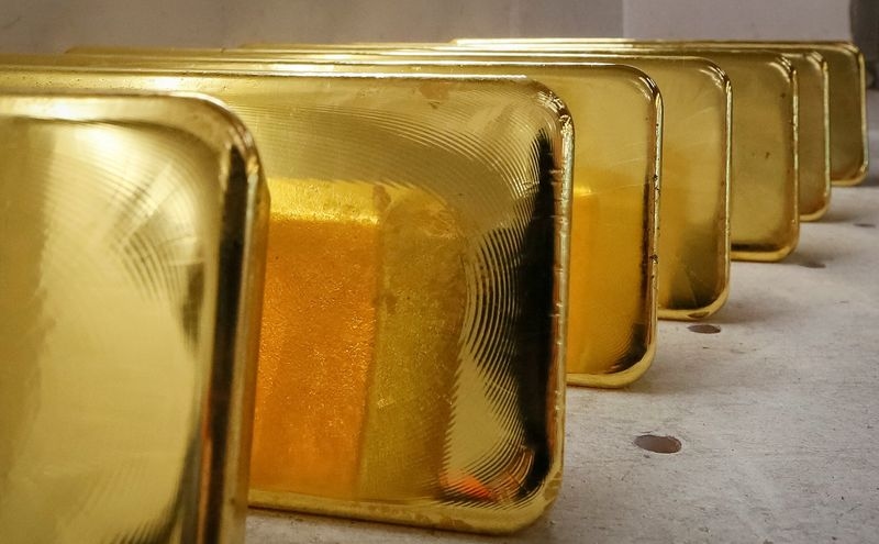 Gold gains on softer dollar, Trump tariff threats