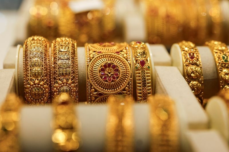Gold firms as dollar eases in run-up to Fed verdict