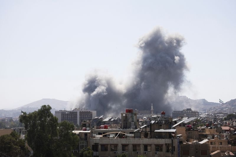 Israel strikes Damascus as fighting rages in southern Syria